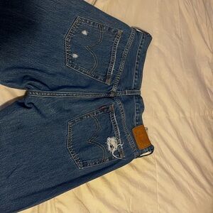 Blue 501 Levi jeans with hole in knee